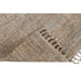 Handwoven PEQURA jute rug corner fold with tassels – detailed view of natural jute weave